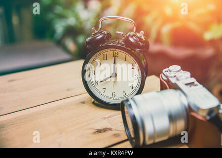 old clock  with retro camera keep time and memory concept with space for text Stock Photo