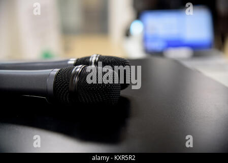 microphone against and music notes blur colorful light background Stock Photo