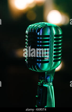 microphone against and music notes blur colorful light background Stock Photo