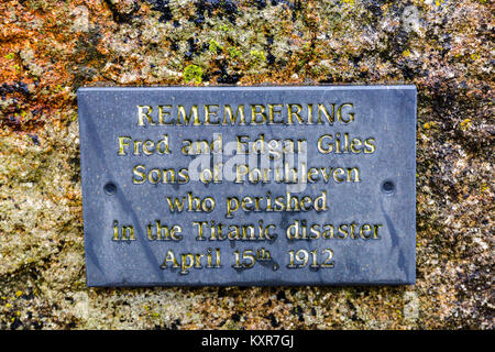 A slate plaque on the Porthleven harbour wall commemorating two brothers from the town lost on the 'Titanic', Cornwall, England, UK Stock Photo
