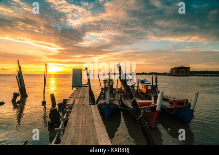 Beautiful sunset at Kuala Kedah Fishing Village. Kedah located in northern Malaysia, it is famous for rice and known as rice bowl of Malaysia. Stock Photo