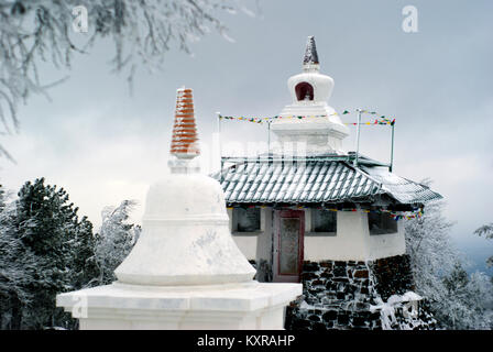 KACHKANAR, RUSSIA - JANUARY 09, 2018: religious buildings on top of a mountain in the Buddhist monastery of Shad Tchup Ling - the only one on the Ural Stock Photo