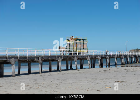 The Victor Harbor Horse Drawn Tram in South Australia travels across the causeway to Granite Island. It is the only horse-drawn tramway in Australia. Stock Photo