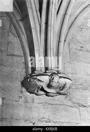 The sculpted console figure on the donjon of Château de Vincennes displays a carved human or mythical form acting as a bracket under projecting stone, integrated into the castle’s masonry Stock Photo