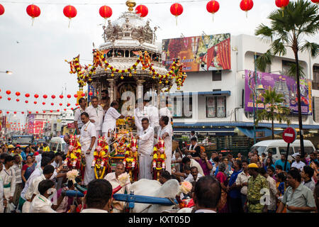 Hindu devotees celebrate the ceremonial worship of Hindu's deity Lord Muruga during the celebration of Thaipusam starting with a chariot procession Stock Photo