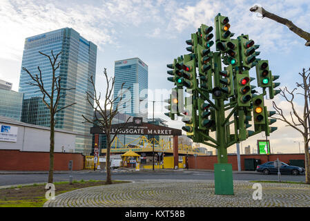 The Traffic Light Tree, a sculpture by the French sculptor Pierre Vivant, in Canary Wharf at the entrance of Billingsgate Fish Market, London, England Stock Photo