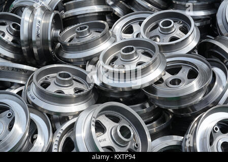 pile of metal pulley wheels at scrapyard leeds yorkshire united kingdom Stock Photo