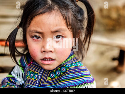 Portrait of little girl wearing traditional tribal dress in Sapa, Vietnam Stock Photo