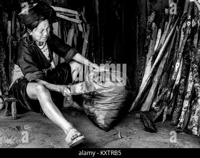 Hmong tribe lady working in her home, sapa, Vietnam Stock Photo