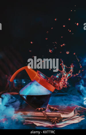 Coffee pot for pour over brewing method with a beautiful coffee splash on a dark background. Action food photography. Alternative coffee brewing conce Stock Photo