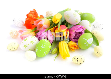 Easter eggs with tulips flowers on white background Stock Photo