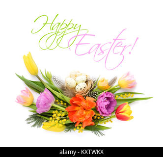 Colorful tulips with easter eggs on white background. Top view. Stock Photo