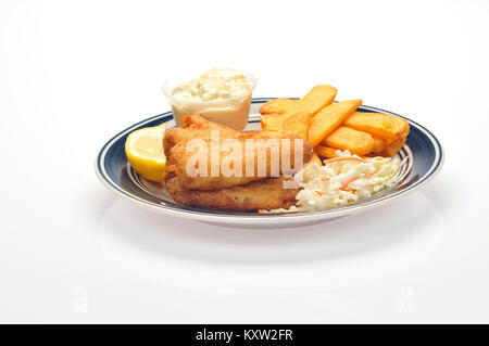 Fried fish and chips with a wedge of lemon, coleslaw and tartar sauce on blue and white plate on white background cut out Stock Photo