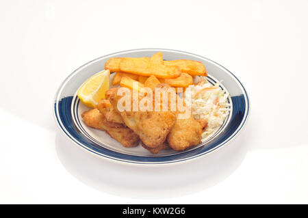 Fried fish and chips with a wedge of lemon and coleslaw on blue and white plate on white background cut out Stock Photo