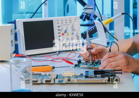 Repair of printed circuit boards with chips Stock Photo
