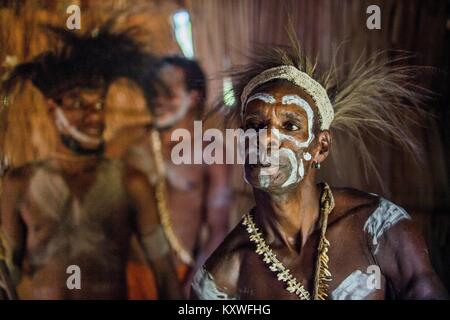 Portrait of a man from the tribe of Asmat people in the ritual face painting.  New Guinea. May 23, 2016 Stock Photo