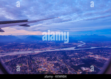 View from airplane window on fields in wing with top view of Vancouver,Canada Stock Photo