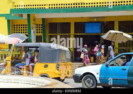 Traditional taxi customers in the city traffic at Hell Ville, Nosy Be Island, Madagascar Stock Photo