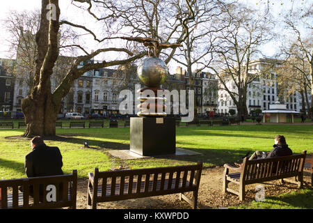 Berkeley Square Gardens, City of Westminster, Mayfair, London, W1. With public sculpture, The Four Lovers, by Lorenzo Quinn. Berkeley Square London. Stock Photo