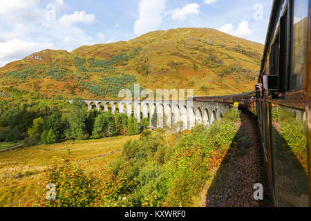 Picture taken from on the Jacobite Express steam train passing over the Glenfinnan Viaduct on the West Highland Line, Scotland Stock Photo