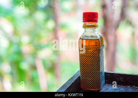 Palm oil in small plastic bottle Stock Photo
