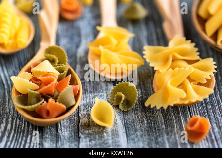 Various mix of pasta on wooden rustic background Stock Photo