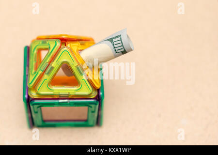 toy house and $ 100 Stock Photo