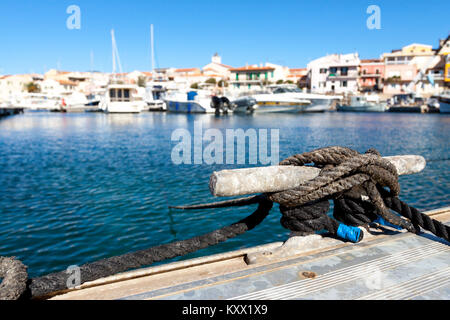 Close-up of the rope that moorage the dock. Stintino, Sardinia. Italy Stock Photo