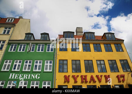 COPENHAGEN, DENMARK - AUGUST 14, 2016: Restaurant 'Heering' and tourist cafe 'Nyhavn 17' on the waterfront of Nyhav in Copenhagen, Denmark on August 1 Stock Photo