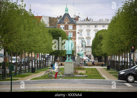 Copenhagen, Denmark – August 15, 2016: View on park and Statue of Carl Frederik Tietgen in Toldbodgade street which is located near Nyhavn harbor in C Stock Photo