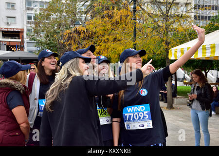 Women runners who will take part in Athens Authentic Marathon race latter in day taking selfie photo Stock Photo