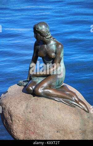 Copenhagen, Denmark – August  15, 2016: Sculpture of The Little Mermaid on rock is a bronze statue by Edvard Eriksen in Copenhagen, Denmark Stock Photo