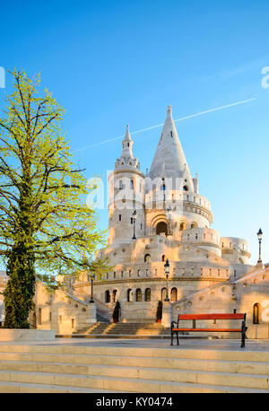 Fishermans Bastion in Budapest, Hungary, early in the morning with spots of sunlight reflected on the stone from the windows of a building nearby. Stock Photo