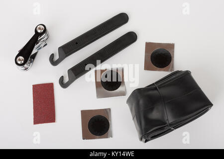 Bike tyre tube puncture repair tool kit, set of tools for repairing  punctured tube, isolated on white background, studio photo. Stock Photo