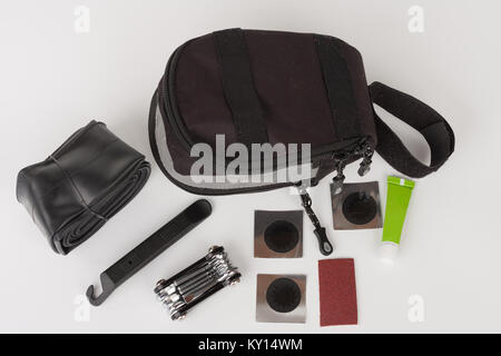 Bike saddle bag and set of tools  for repairing  punctured tube, isolated on white background, studio photo. Stock Photo