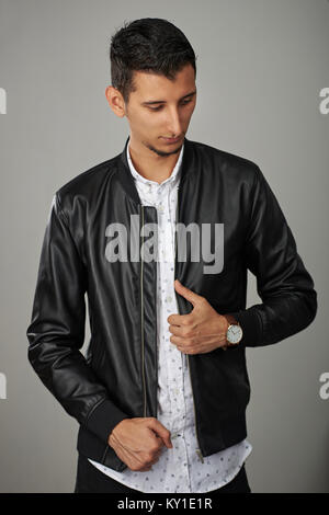 Fashion young arab man in black leather jacket Stock Photo