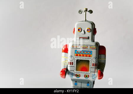 Vintage tin toy robot isolated, drone delivery artificial intelligence concept Stock Photo