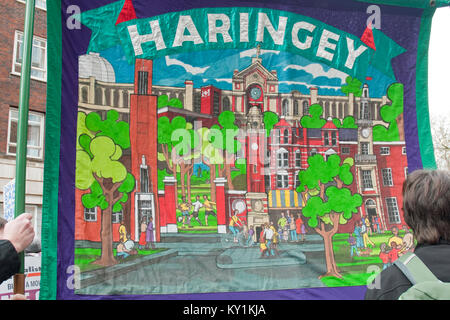 Close up of colourful embroidered trade union banner from Haringey showing iconic landmarks in Haringey. Unison Trade Union banner during a rally. Stock Photo