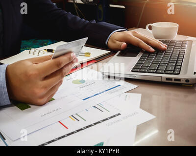 Businessman holding credit card and using laptop. Online shopping Stock Photo