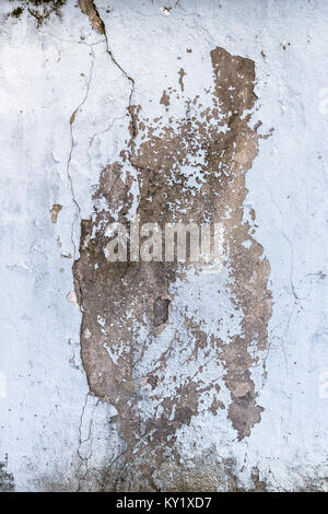 Cracking and peeling paint on a concrete wall. Perfect background with space. Stock Photo