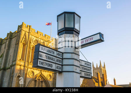 View of the 'Pillar Of Salt' traffic sign sited on Angel Hill in the centre of Bury St Edmunds with the medieval Abbey Gate in the background, Suffolk Stock Photo