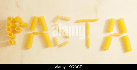 Phrase PASTA made of cooked spaghetti on vintage background Stock Photo