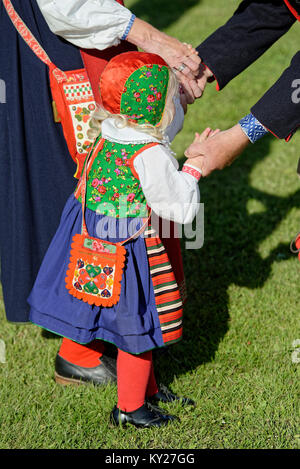 A little girl in traditional costume in midsummer celebration Stock Photo