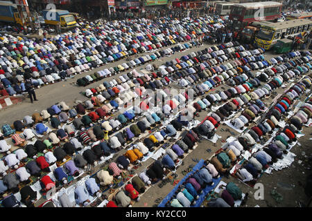 Tongi, Bangladesh. 12th Jan, 2018. Bangladeshi Muslim devotees offer Jumma prayer on the first day of the Biswa Ijtema, the second largest Muslim congregation of the world, at Tongi, near Dhaka, Bangladesh. The first phase of Biswa Ijtema starts today with Jumma prayer and Muslim devotees from across the world participate in the second world congregation of Muslims. Credit: Suvra Kanti Das/ZUMA Wire/Alamy Live News Stock Photo