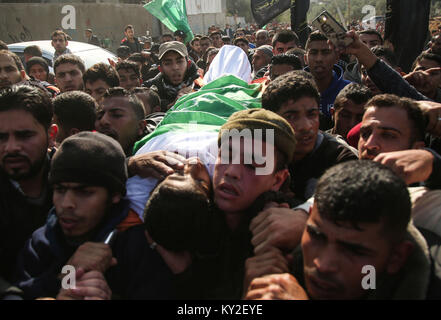 GRAPHIC CONTENT: Refugee Camp, The Gaza Strip, Palestine. January 12, 2018 - Al-Maghazi Refugee Camp, The Gaza Strip, Palestine - Funeral of Amir Abu Musaed a 16-year-old Palestinian from Al-Maghazi refugee camp in central of the Gaza Strip, Amir was shot during clashes between Palestinians and Israeli troops along the eastern Gaza border. Credit: Hassan Jedi/Quds Net News/ZUMA Wire/Alamy Live News Stock Photo