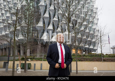 London, 12th January 2018: The waxwork of Donald Trump stands outside the US Embassy at Nine Elms in south London on the day when the President announced on Twitter, his refusal to visit London and open the new state premises after its historic move from Grosvenor Square, in London, England. The waxwork is the property of Madame Tussauds and took a team of 20 artists 4 months to create, going on display on the day of his innauguration in 2017. It is valued at £150,000. Photo by Richard Baker  / Alamy Live News Stock Photo