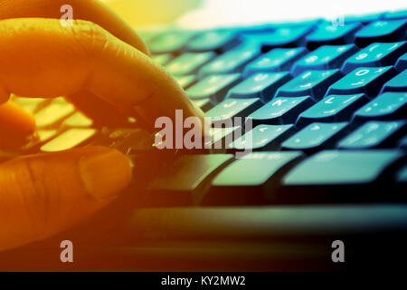 Man's hand typing on Computer keyboard Stock Photo