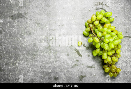 bunch of green grapes. On the stone table. Stock Photo