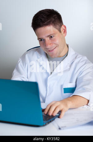 Young scientist works with laptop or netbook Stock Photo