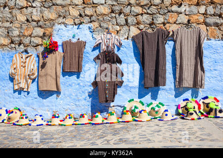 CHEFCHAOUEN, MOROCCO - MARCH 01, 2016: Traditional moroccan berber textile and hats on the market in chefchaouen, Morocco. Stock Photo